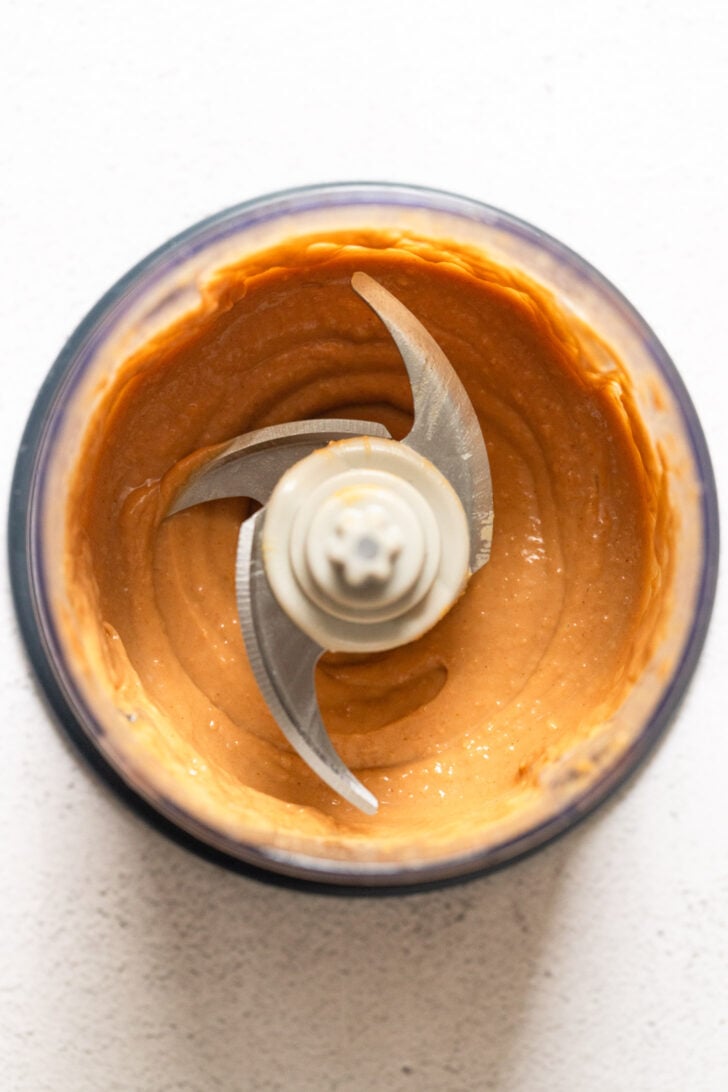 Peanut sauce in food processor after blending.