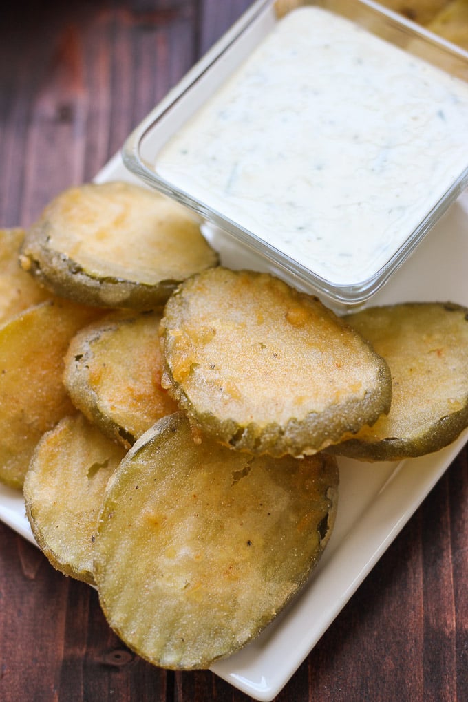 Beer Battered Fried Pickles -- light, crispy, and served with a buttermilk parsley sauce! // Fork in the Kitchen