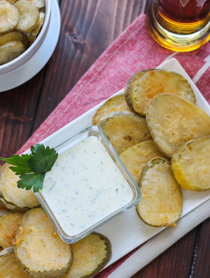 Beer Battered Fried Pickles -- light, crispy, and served with a buttermilk parsley sauce! // Fork in the Kitchen
