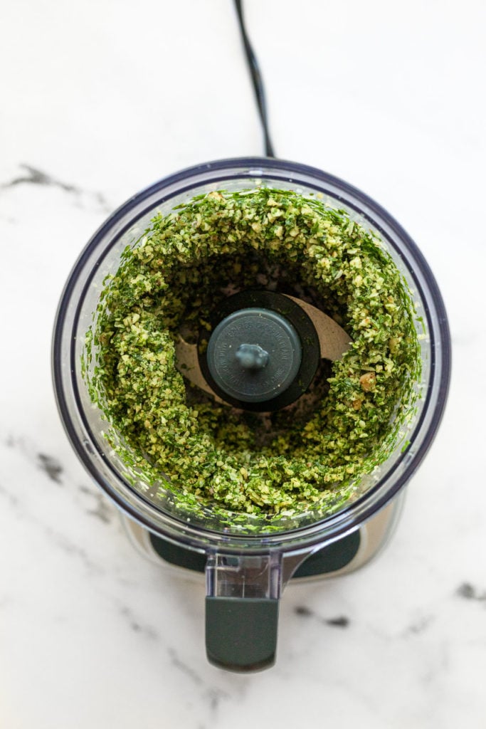 Dry pesto ingredients finely chopped in food processor.