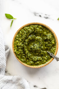 Basil mint pesto in bowl with spoon.