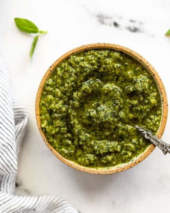 Basil mint pesto in bowl with spoon.
