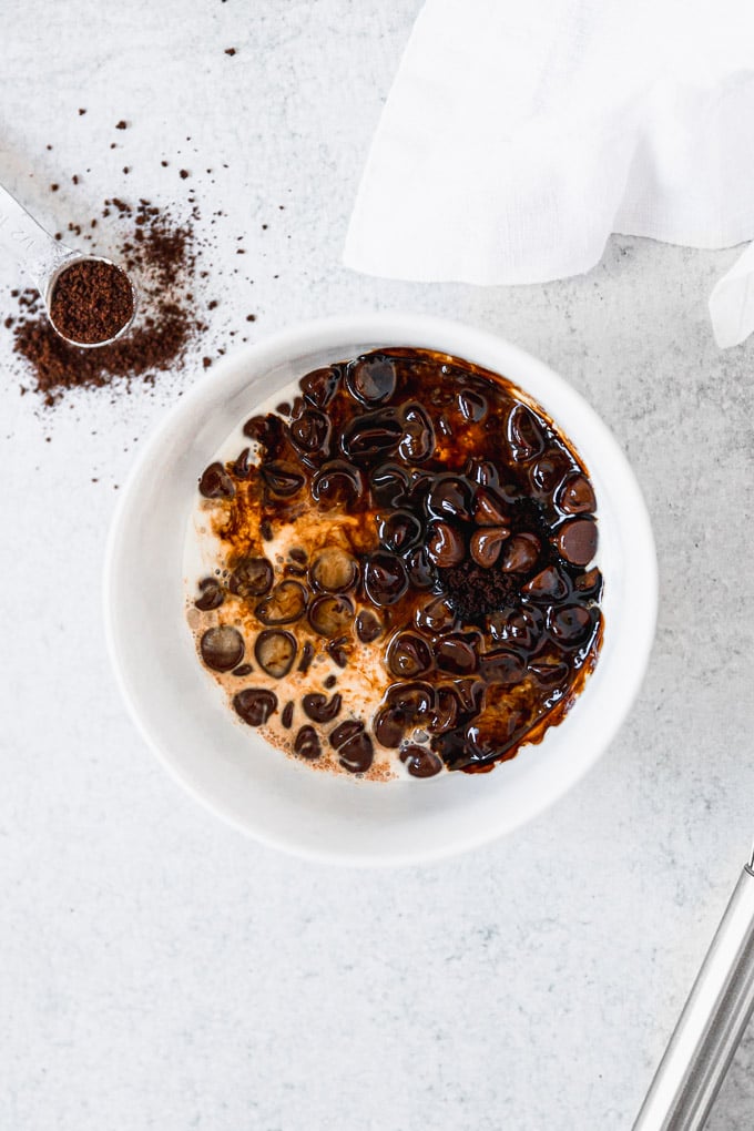 chocolate chips, cream, and espresso powder in bowl to make espresso ganache