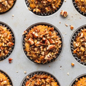 top down of baked banana carrot muffins in muffin tin