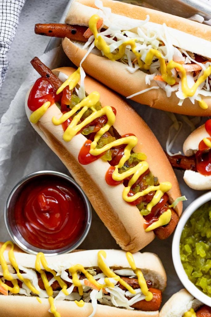 Tray with carrot dog topped with ketchup and mustard.
