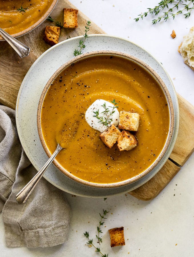 Bowl of squash soup with spoon.