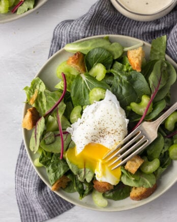 Simple Dijon Salad - a tangy dressing drizzled over a bed of lettuce with a perfectly poached egg and crunchy croutons! Simple, delicious dinner! | Fork in the Kitchen