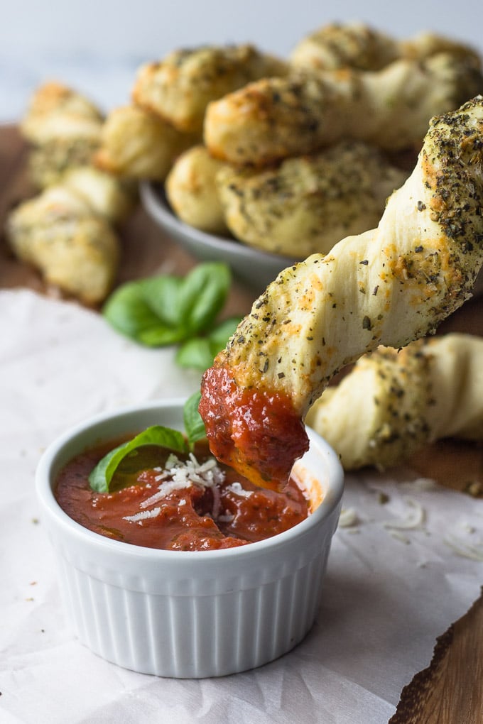 Ultimate Garlic Herb Breadsticks - Twisty breadsticks loaded with garlic butter, Italian herbs, and parmesan cheese - an excellent side or appetizer! | Fork in the Kitchen