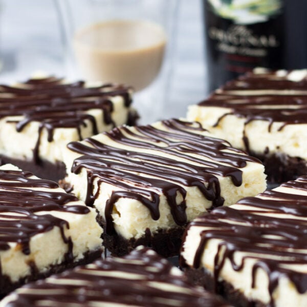 Baileys Cheesecake Brownies with Espresso Ganache - A fudgey mocha brownie, topped with a rich, luxurious cheesecake layer, and drizzled with an espresso ganache! An indulgent dessert perfect for St. Patrick's Day, or a get-together! | Fork in the Kitchen