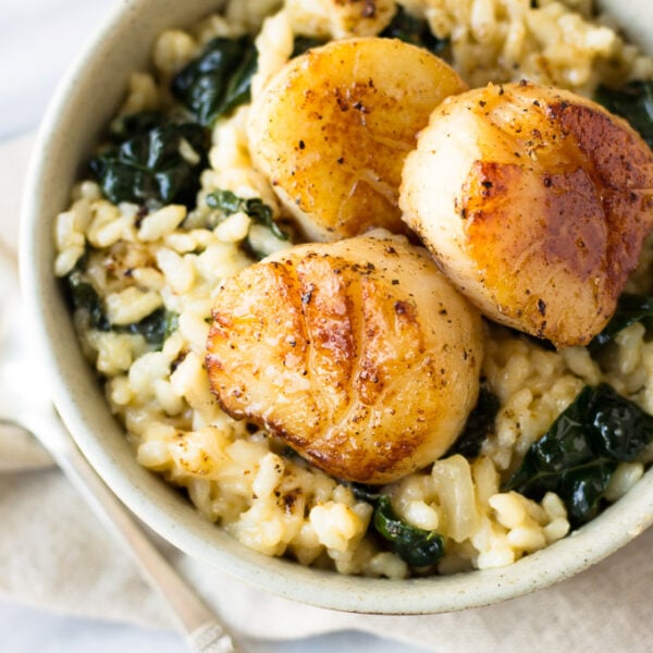 Parmesan Kale Risotto with Scallops for Two - A comforting, cheesy, creamy risotto packed with nutritious kale and melt-in-your-mouth scallops! Perfect for date night! | Fork in the Kitchen
