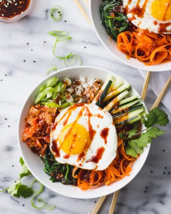 Spicy Vegetarian Bibimbap - A bowl of chewy rice, sautéed veggies, a flavorful gochujang sauce, and a creamy fried egg! Customizable, and perfect for a weeknight dinner! | Fork in the Kitchen
