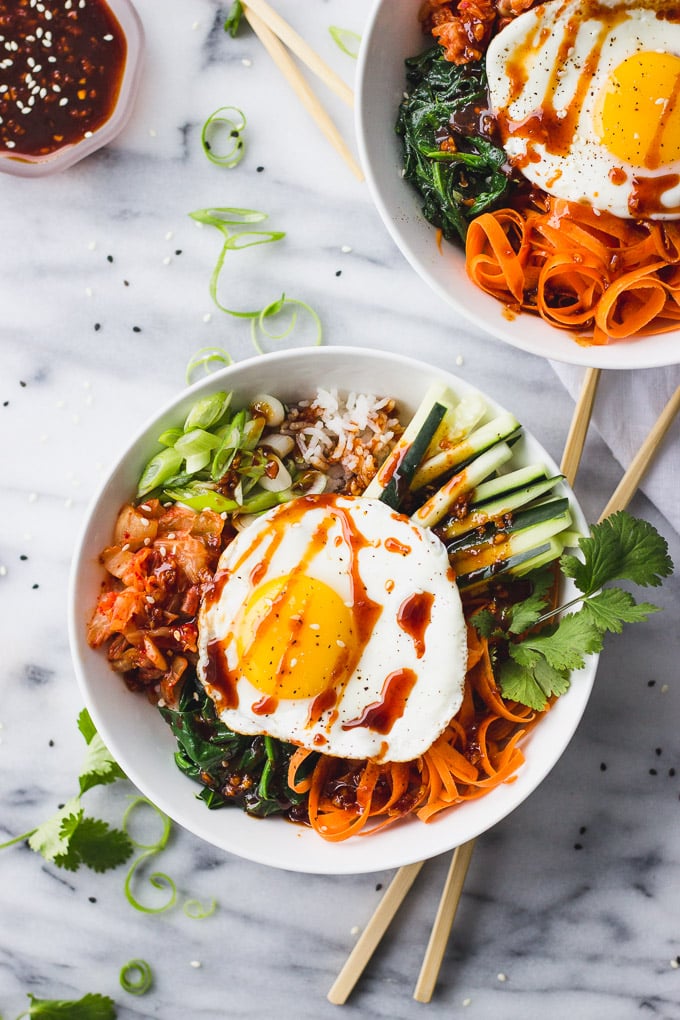 Spicy Vegetarian Bibimbap - A bowl of chewy rice, sautéed veggies, a flavorful gochujang sauce, and a creamy fried egg! Customizable, and perfect for a weeknight dinner! | Fork in the Kitchen