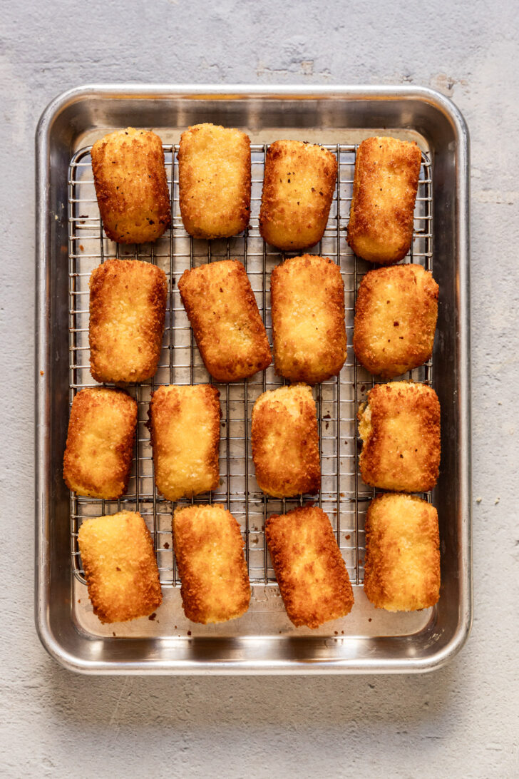 Croquettes on cooling rack after cooking.