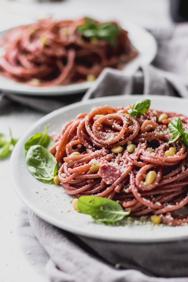 red wine spaghetti on plate by fork in the kitchen