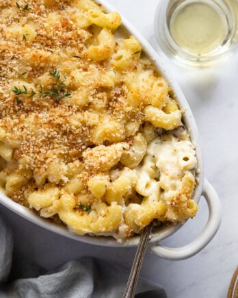 Mac and cheese in dish with spoon.