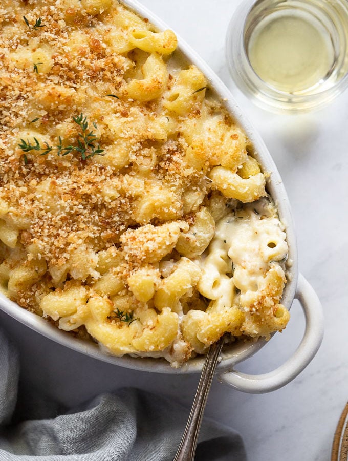 Mac and cheese in dish with spoon.