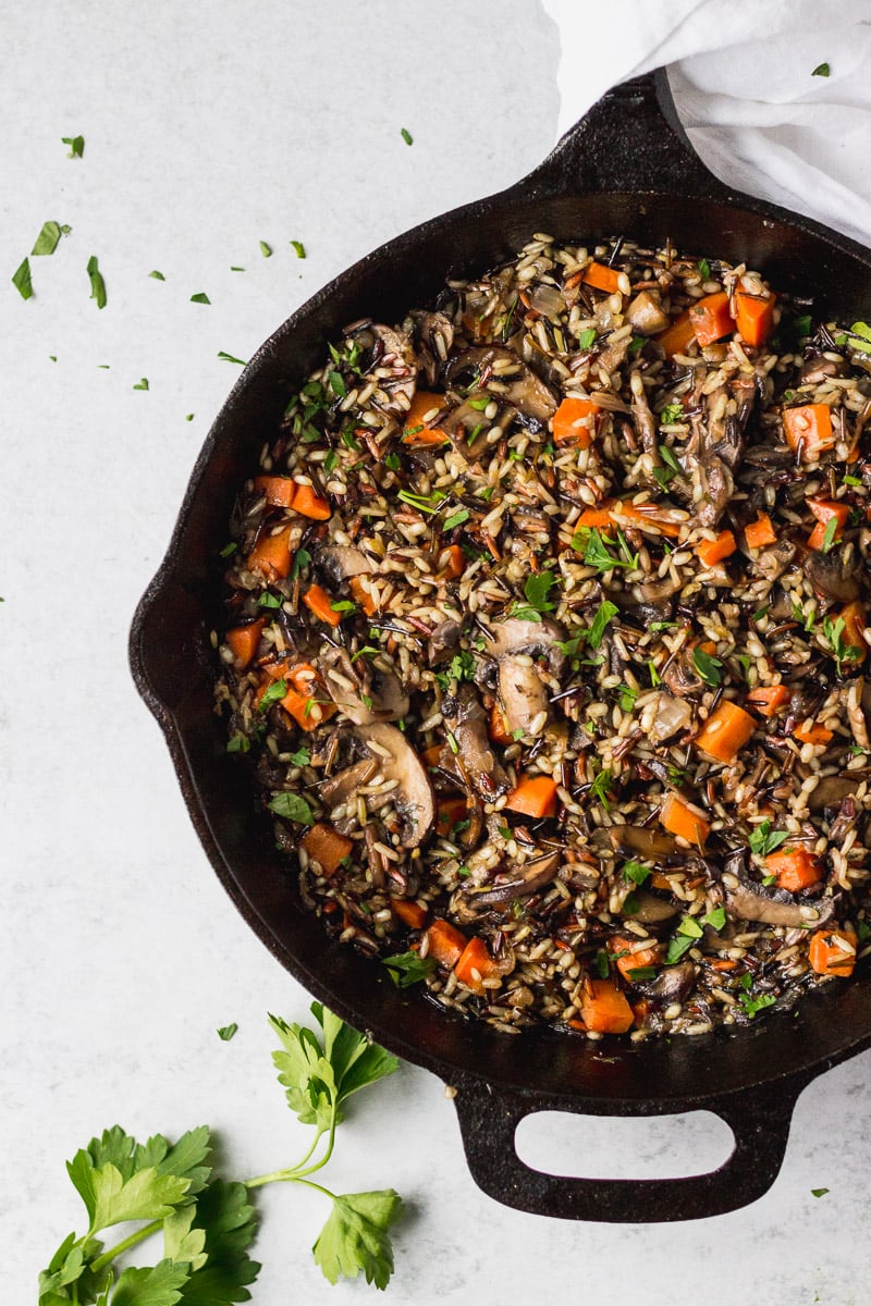 Cast iron skillet with wild rice pilaf.