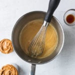saucepan with melted sugar and honey with whisk.