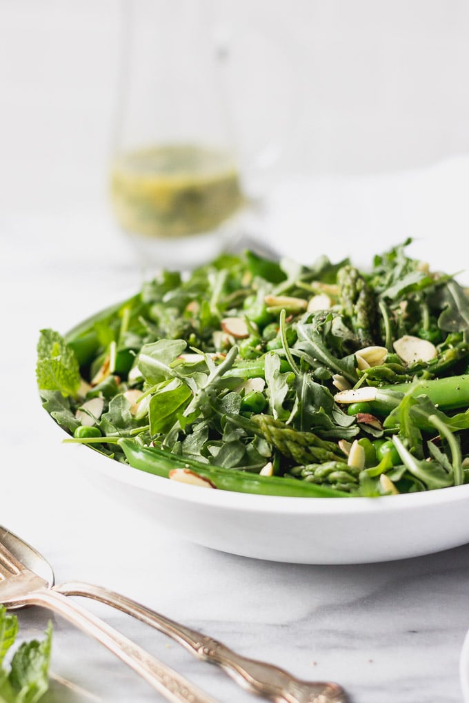 green vegetable salad with asparagus and peas in bowl