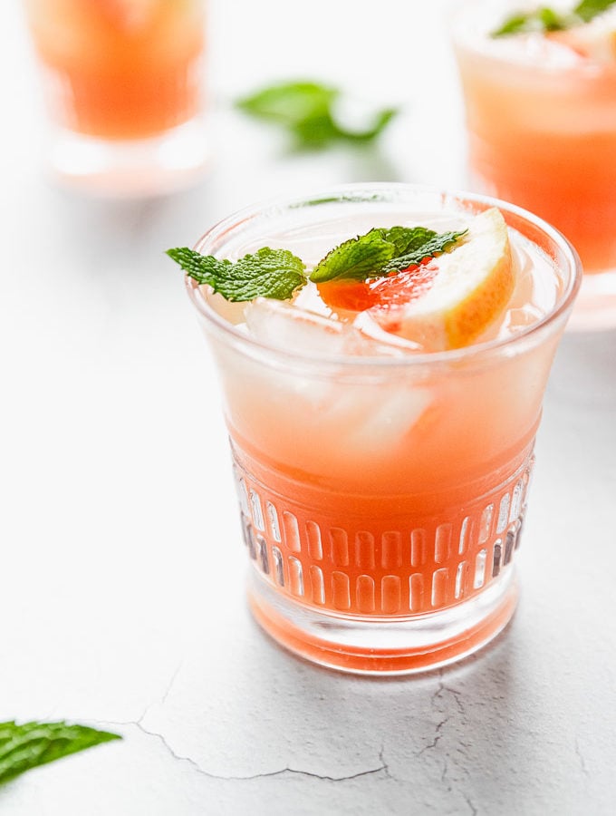 grapefruit mint cocktail in glass with ice