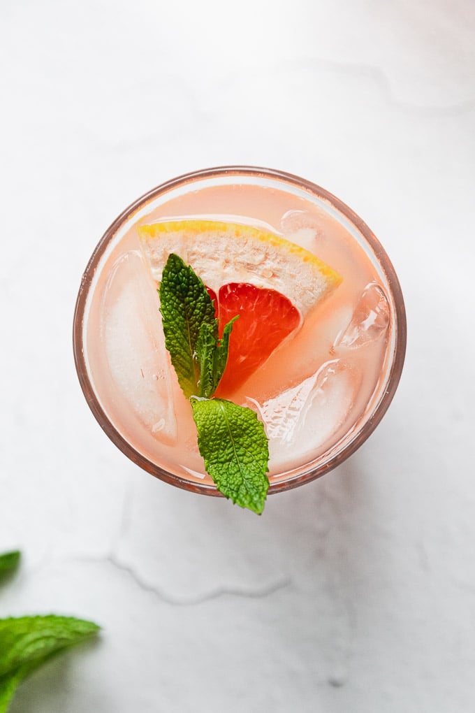grapefruit mint cocktail in glass with ice