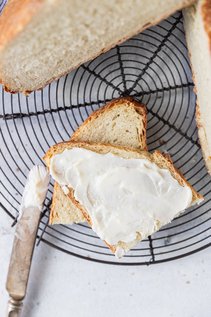 slice of french bread loaf spread with butter