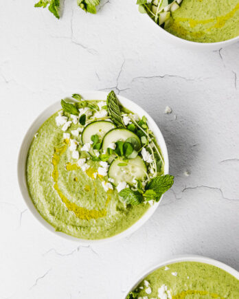 cucumber mint gazpacho up close in bowl with olive oil