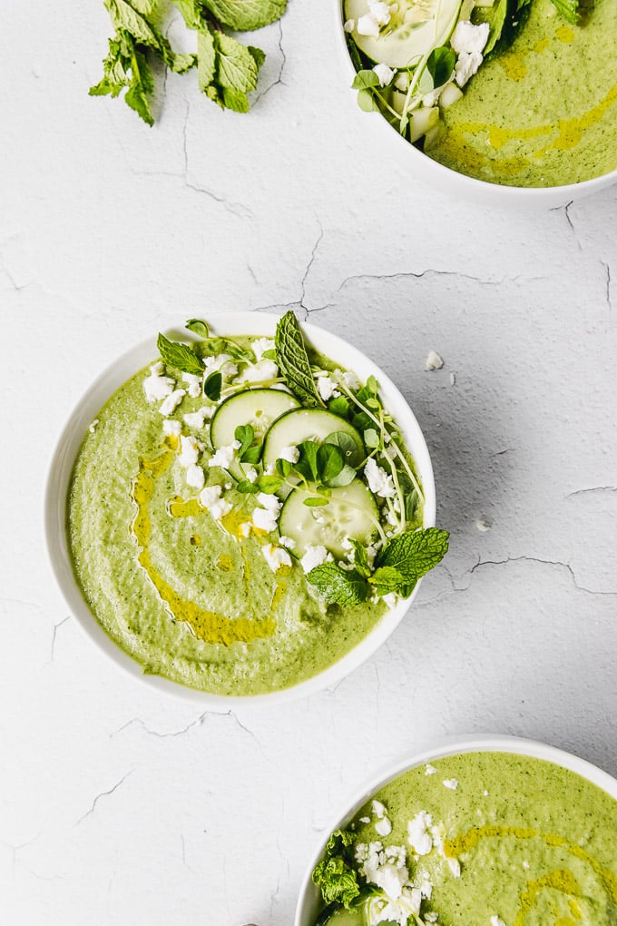 cucumber mint gazpacho up close in bowl with olive oil