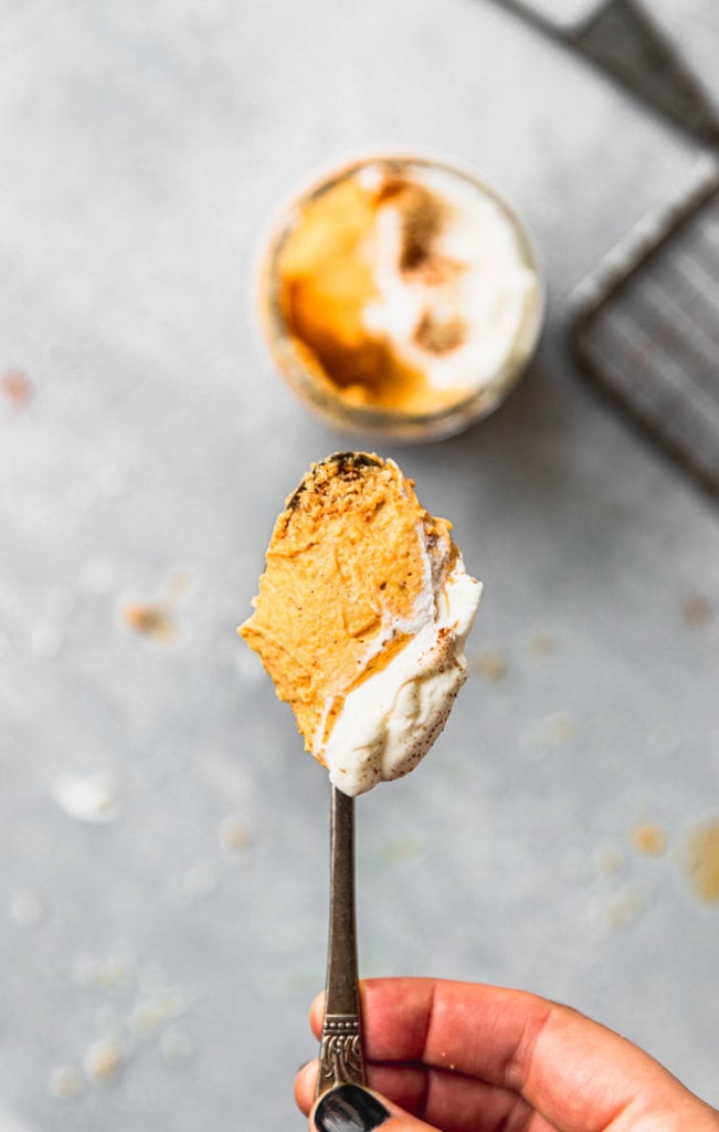 holding spoon of pumpkin mousse