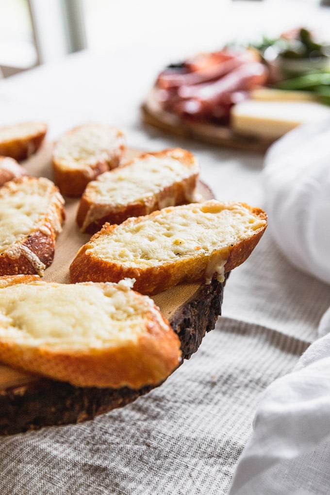 Cheese melted onto crostini.