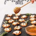 sweet potato goat cheese bites on black serving tray with honey drizzle