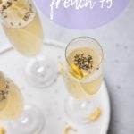 champagne flute with lavender flowers and french 75 with lemon twist
