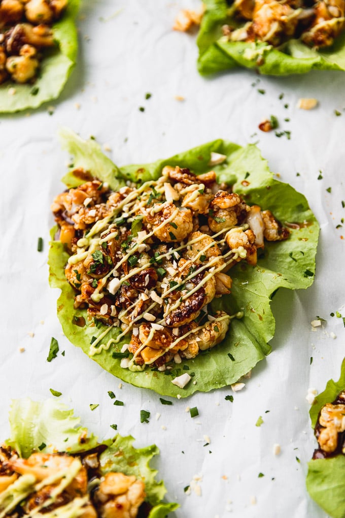 cauliflower lettuce wrap with avocado sauce drizzled on top