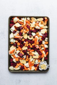 root vegetables on baking sheet uncooked