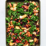 root vegetables on baking sheet roasted with kale