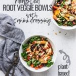 two bowls of roasted root veggie bowls made vegan with forks and blue linen