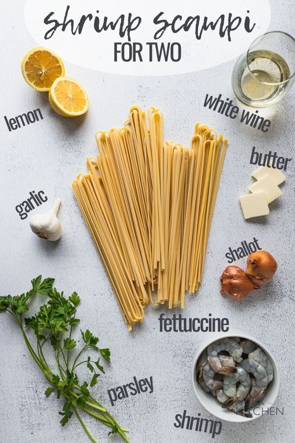 Ingredients laid out: pasta, butter, white wine, lemon, garlic, parsley, shrimp.