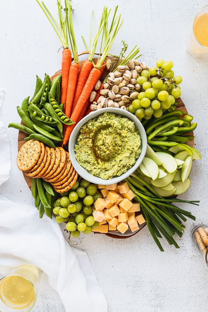 overhead view of st. patrick's day snack board with edamame hummus