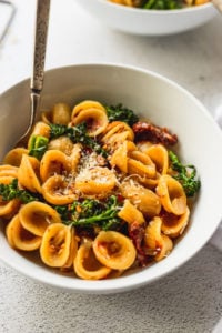 up close bowl of orecchiette pasta with spoon