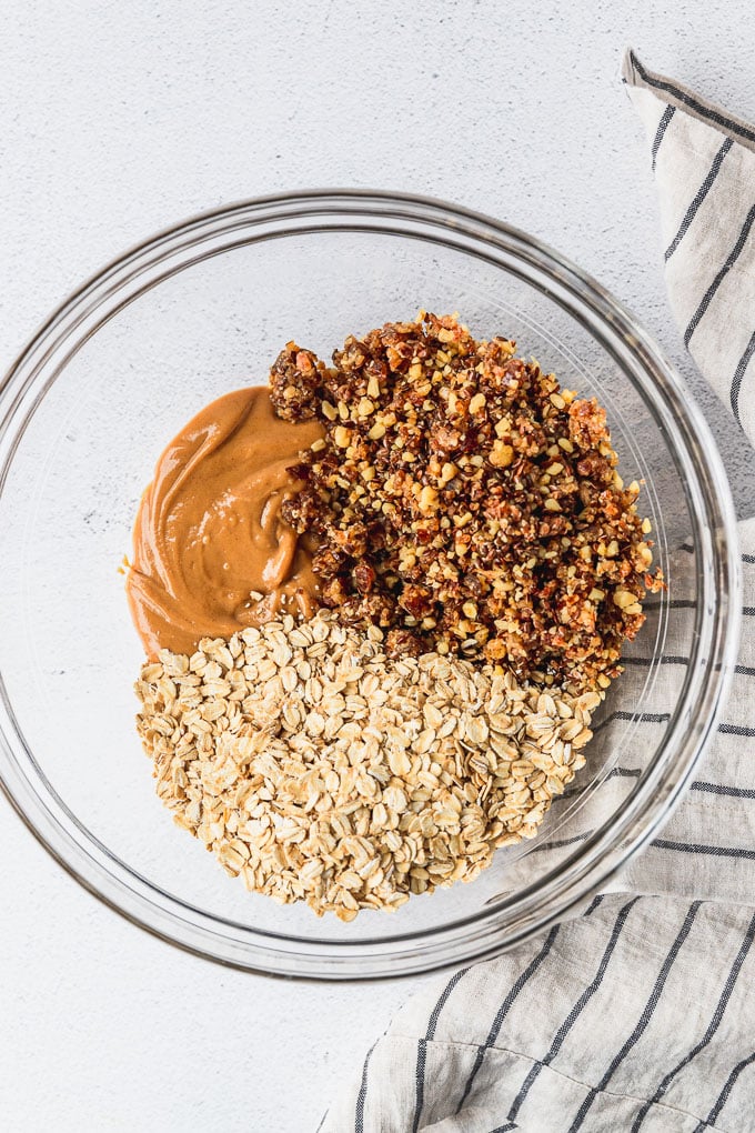 Bowl of oats, peanut butter, and chopped date mixture.
