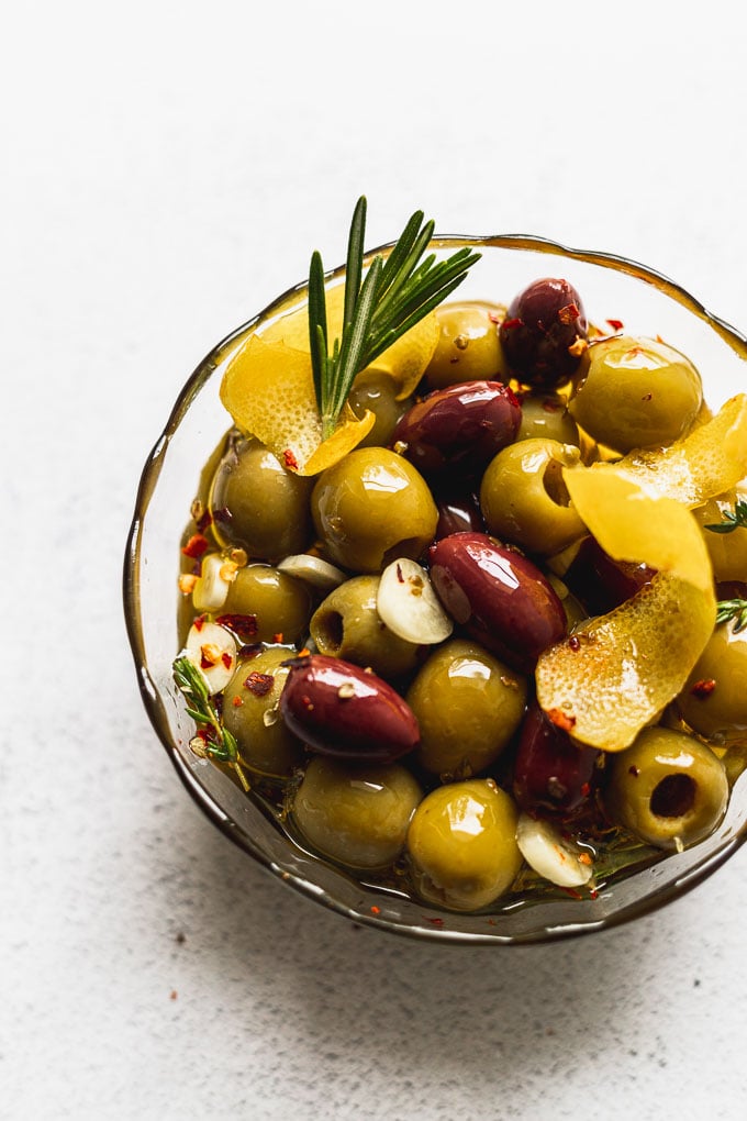 glass bowl of marinated olives up close