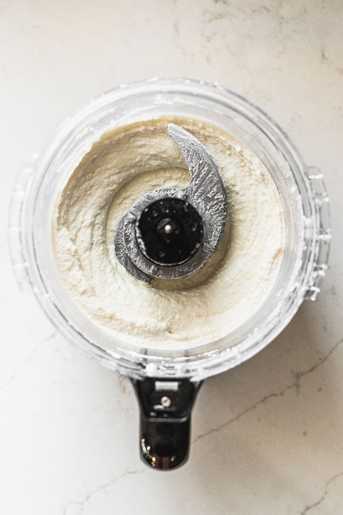 food processor with whipped feta inside 