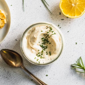 looking into jar of garlic aioli with spoon next to it