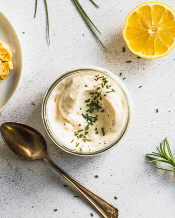 looking into jar of garlic aioli with spoon next to it