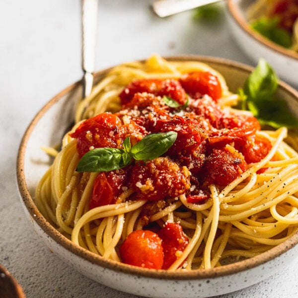 side view of cherry tomato sauce on pasta