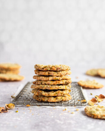stacked pistachio butter cookies on wire rack