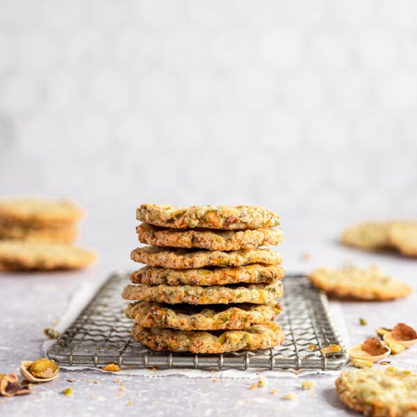 stacked pistachio butter cookies on wire rack