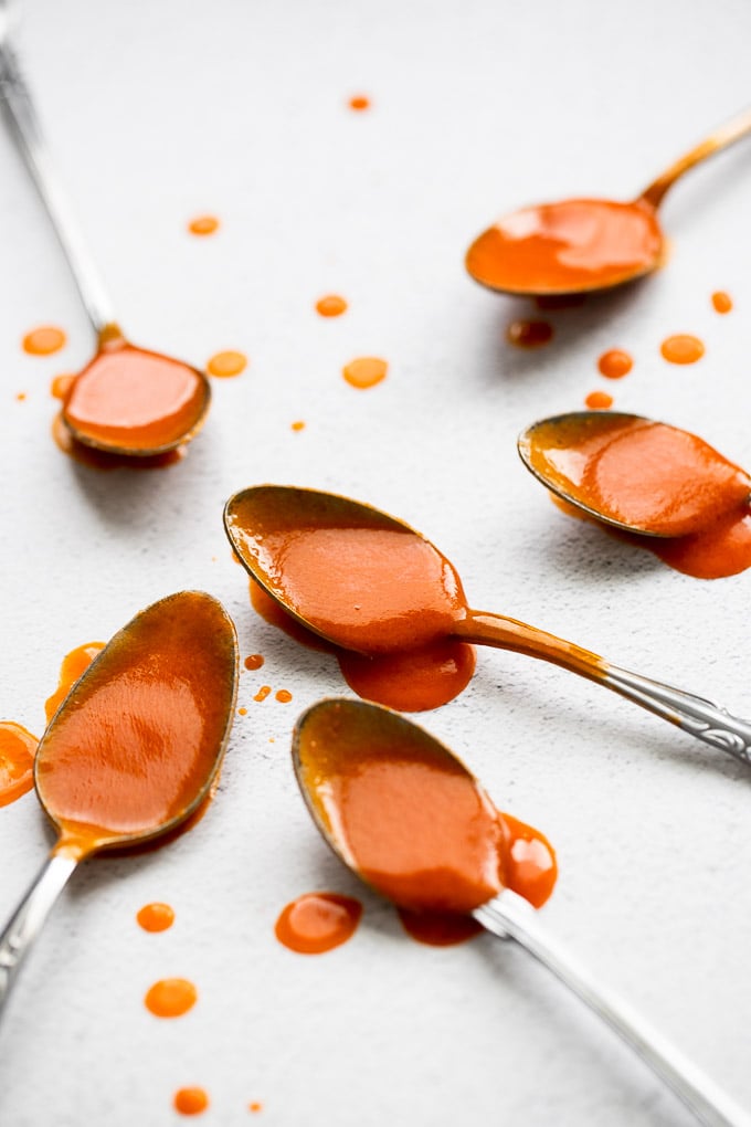 spoons with buffalo sauce on them