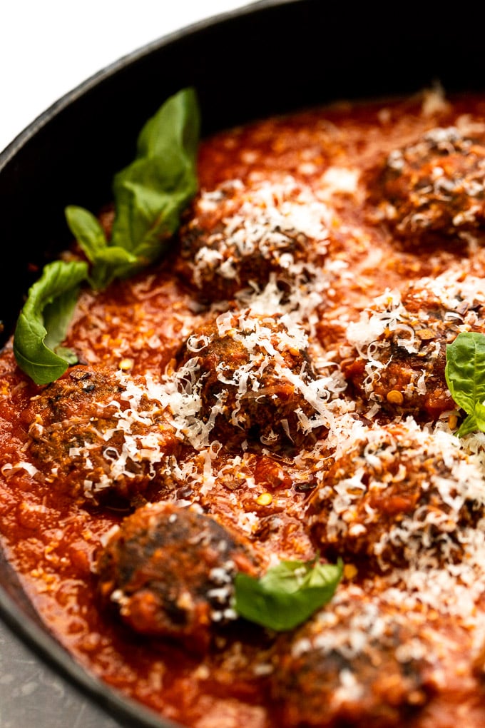 Up close vegetarian meatball in red sauce.