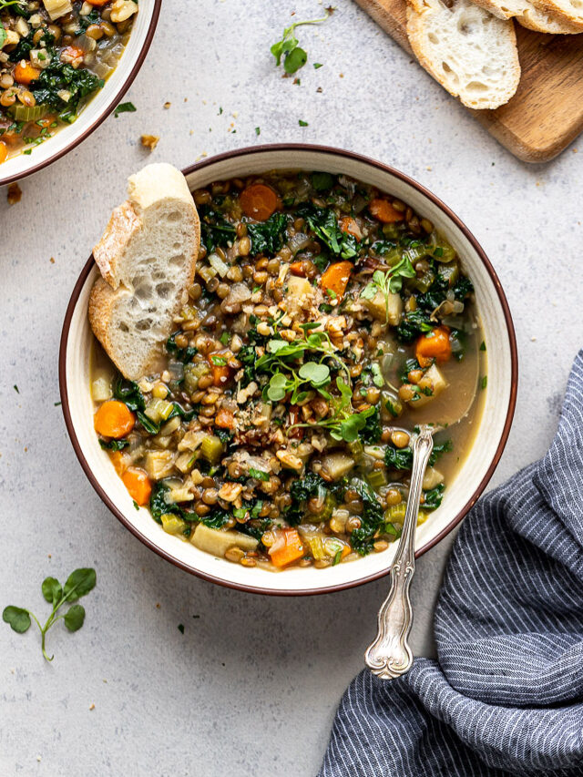 bread in bowl of vegetable lentil soup